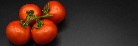 Fresh tasty tomato, all organic tomato, fresh red organic tomato, isolated on black backgroundの写真素材