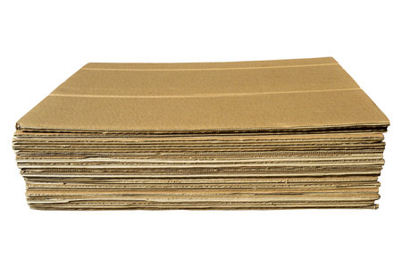 Brown and beige colored corrugated cardboard detail, isolated on white backgroundの写真素材