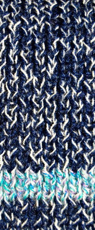 Pattern fabric made of wool. Handmade knitted fabric blue wool background texture