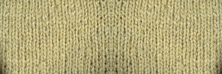 Pattern fabric made of wool. Handmade knitted fabric gray wool background texture