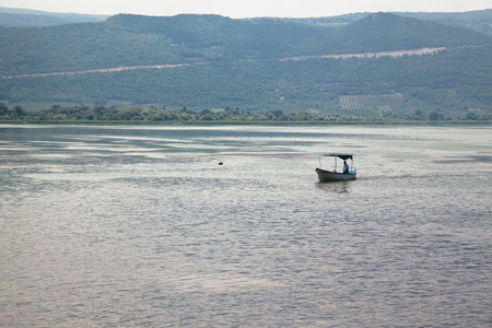 Touristic sightseeing wooden boats around Ulubat or Uluabat Lake in Bursa, Turkey, June 25 2023のeditorial素材