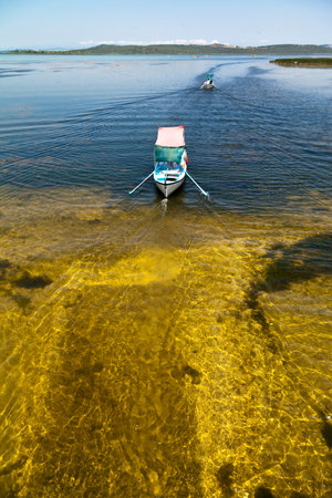 Touristic sightseeing wooden boats around Ulubat or Uluabat Lake in Bursa, Turkey, June 25 2023のeditorial素材