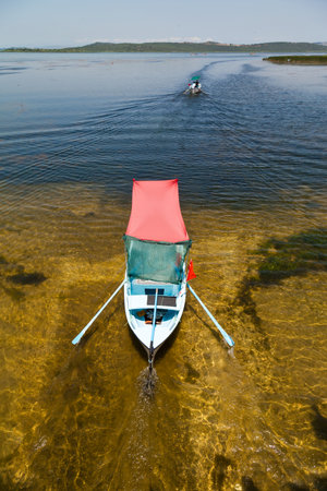 Touristic sightseeing wooden boats around Ulubat or Uluabat Lake in Bursa, Turkey, June 25 2023のeditorial素材