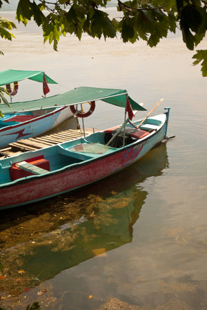 Wooden fishing boats waiting by Ulubat or Uluabat Lake in Bursa, Turkey, June 25 2023