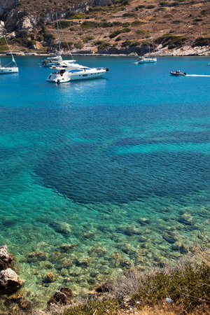 Yachts and ships from various countries are on vacation in the natural harbor area of the Ancient City of Knidos. Turkey Mugla Datca, June 28 2023のeditorial素材