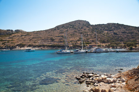 Yachts and ships from various countries are on vacation in the natural harbor area of the Ancient City of Knidos. Turkey Mugla Datca, June 28 2023のeditorial素材