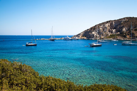 Yachts and ships from various countries are on vacation in the natural harbor area of the Ancient City of Knidos. Turkey Mugla Datca, June 28 2023のeditorial素材