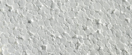 White styrofoam surface background texture closeup detail, white foam plastic