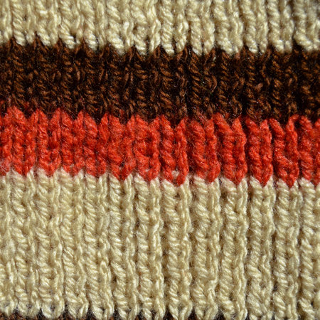 Pattern fabric made of wool. Handmade knitted fabric white brown and beige wool background textureの写真素材