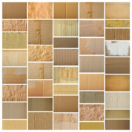 Brown beige and brown corrugated cardboard paper pieces, isolated on white backgroundの写真素材