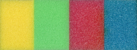 Colorful dishwashing and cleaning sponges, soft sponges which are one of the necessary equipment for cleaningの写真素材
