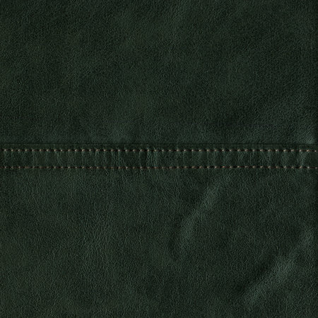 Imitation cowhide seamy green leather texture close up, useful as background for any design workの写真素材