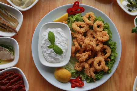 carefully prepared fish products and appetizers on wooden table