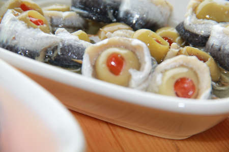 carefully prepared fish products and appetizers on wooden tableの写真素材