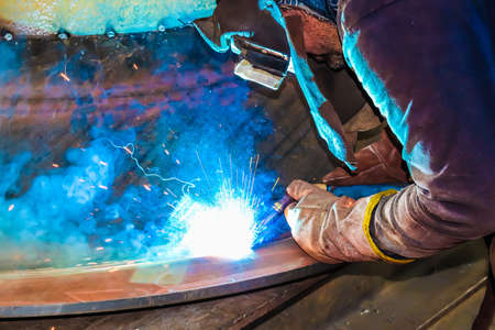 Welding of metal structures with sparks and electric arc welding.