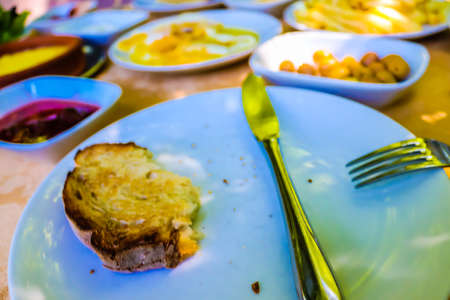 Breakfast with bread and vegetables in a restaurant. Selective focus.の写真素材