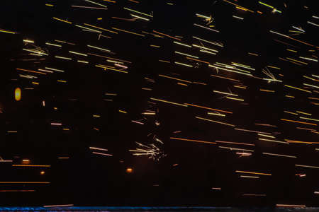 Sparks from welding with sparks at night. High quality photoの写真素材
