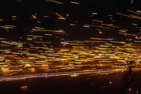 sparks from welding on the street at night. High quality photoの写真素材