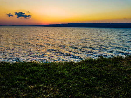 Sunset on the shore of Lake Garda in northern Italy.の写真素材