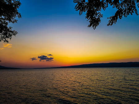 Sunset on the lake. Beautiful nature background.