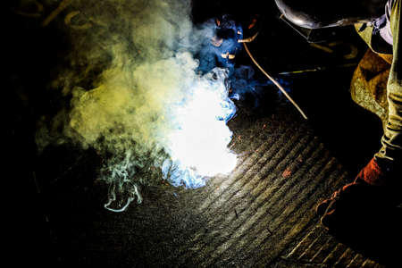 Welder at work. Sparks from welding metal. Sparks from welding.