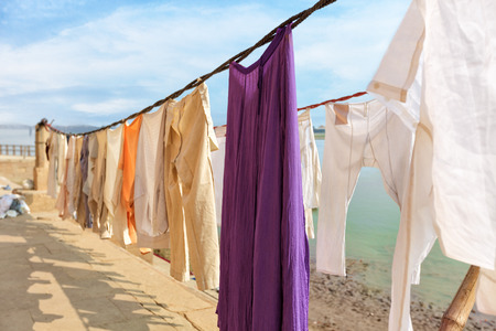 streets of holy Varanasi, traditional clothing dried in the sun, Indiaの写真素材