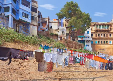 Ghats of holy Varanasi, traditional clothing dried in the sun, Indiaの写真素材