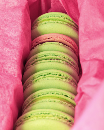 Delicious sweet buffet with colorful macarons in a boxの写真素材
