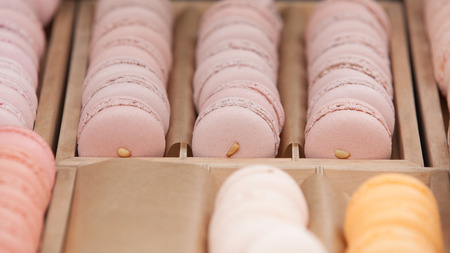 Delicious sweet buffet with colorful macarons in a  box. Shallow depth of fieldの写真素材