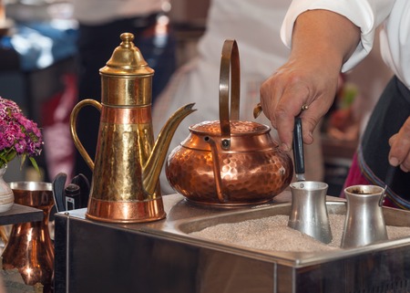 Turkish coffee pots jezve. Drink brewed on the sandの写真素材