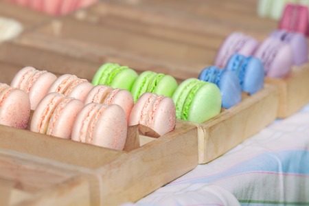 Delicious sweet buffet with colorful macarons in a  box. Shallow depth of fieldの写真素材
