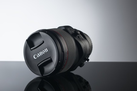 Kiev, Ukraine - June 2015: Canon tilt-shift lens close up on black backgroundのeditorial素材