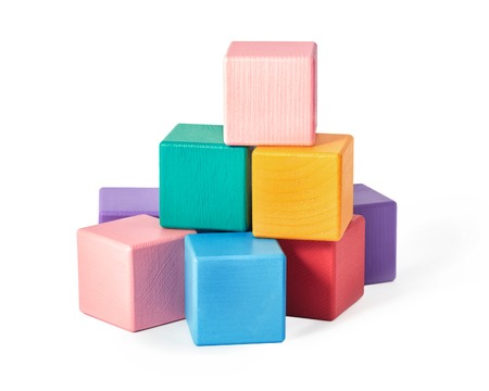 Colourful wooden toy blocks isolated on white background