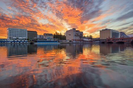 Berlin, Germany, - August 30, 2015: Sun rising over Spree river and Oberbaum Bridge at Friedrichshain-Kreuzberg borough of Berlinのeditorial素材