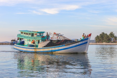Doung Dong, Phu Quoc island, Vietnam - December 29, 2014: Traditional asian fishing. Vietnamese men...