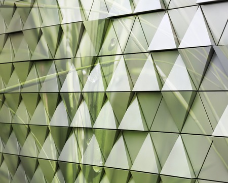 Abstract close-up view of modern aluminum ventilated triangles on facade