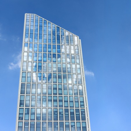 Abstract view of modern facade on sky backgroundの写真素材