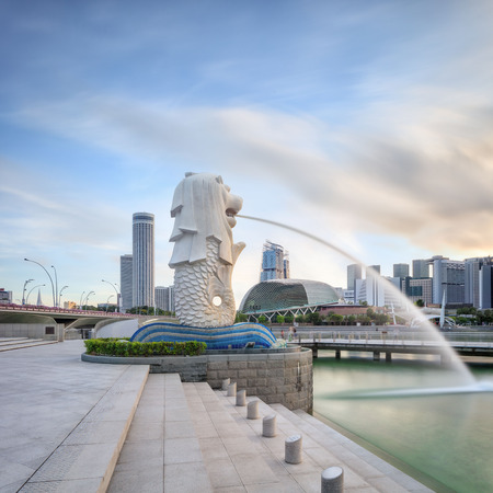 Singapore, Republic of Singapore - May 4, 2016: Singapore central quay at sunrise with Merlion lion fountain on foregroundのeditorial素材