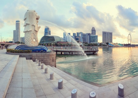 Singapore, Republic of Singapore - May 4, 2016: Singapore central quay at sunrise with Merlion lion fountain on foregroundのeditorial素材