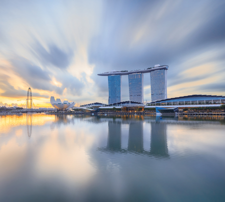 Singapore, Republic of Singapore - May 4, 2016: Marina Bay Sands hotel reflecting in sunrise waterのeditorial素材
