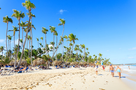 Punta Cana, Dominican Republic - December, 2017: tourists relaxing on sunny beachのeditorial素材