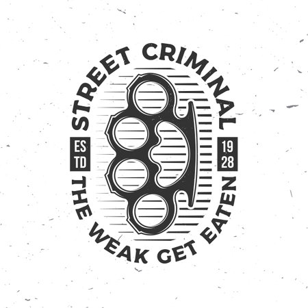 The weak get eaten. Classic gangster badge design. Vector illustration. Vintage monochrome label, sticker, patch with knuckle duster silhouette.のイラスト素材