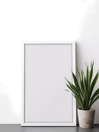 Gray wall with white signboard mockup and some greens and copy space backgroundの素材