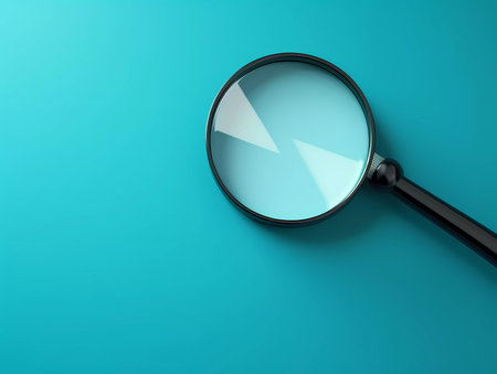 Close up Single Magnifying Glass on blue backgroundの素材