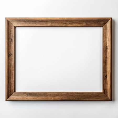 Wooden picture frame isolated on white background with copy space. Image display concept.の素材