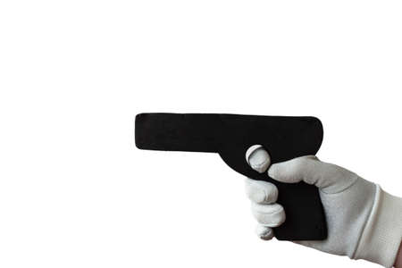 A gray gloved hand holds a dummy pistol for self defense training.