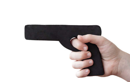 Hand holding a black dummy pistol for self defense training.
