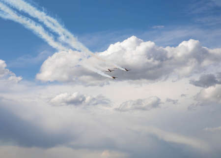 Four small planes fly by leaving a trail behind them place for text template