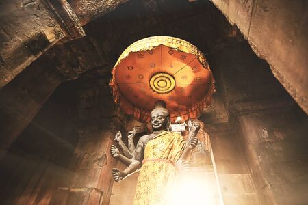 Statue of Vishnu inside a temple in cambodia