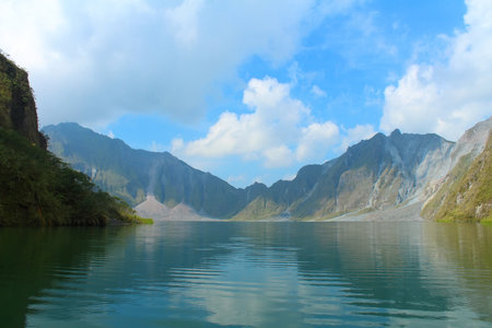Beautiful landscape mountain lake with clear water and blue sky. Lake in crater mount Pinatubo volcano, Angeles, Luzon, Philippines.の写真素材